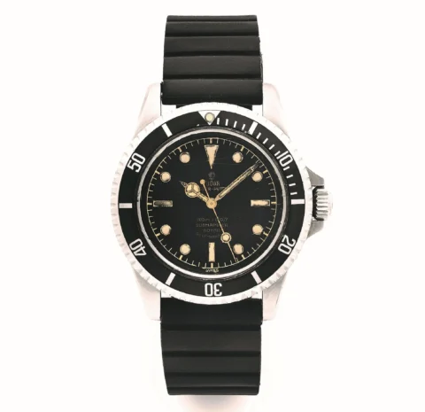 TUDOR Oyster Prince Submariner « Square Crown Guards / Meter first » Ref. 7928, n° 305108 Vers 1959 Boîtier : rond, lunette graduée, couronne et fond vissés, protection "square crown guard", gravé « IV.59 » à l’intérieur, signé Rolex Cadran : « Tropical »