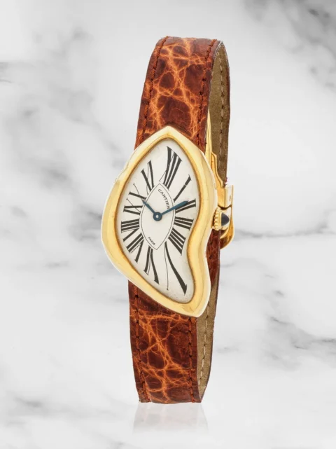 Cartier. An unusual and very limited edition 18K gold manual wind wristwatch made as part of the Paris 1991 edition Cartier. Surprenante et rare montre bracelet en or jaune 18K (750) en édition très limitée Paris 1991 mouvement mécanique Model: Crash Date: Circa 1991