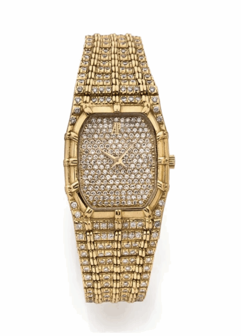 AUDEMARS PIGUET BAMBOO, vers 1980 Étonnante montre bracelet de dame en or jaune 18K (750). Boîtier octogonal. Lunette en or jaune. Cadran or entièrement serti diamants. Aiguilles or. Mouvement quartz.